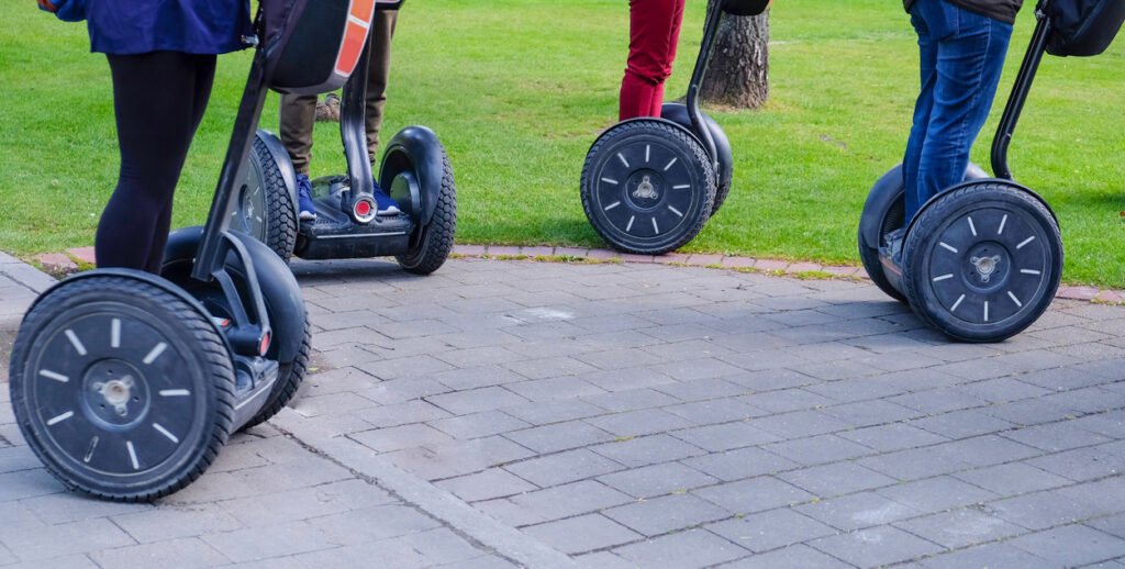 Group of tourist riding segway in the city